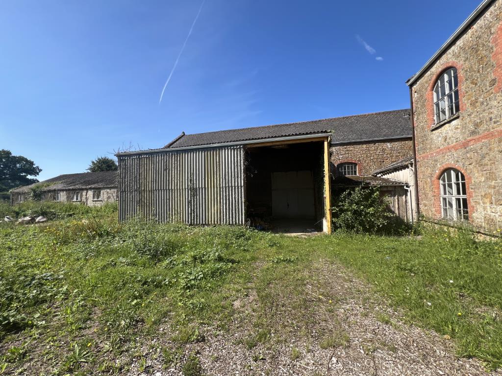 Lot: 70 - MULTI-FACETED RESIDENTIAL AND COMMERCIAL SITE WITH POTENTIAL - General view from site of entrance to unit 2 and log store, showing unit 3